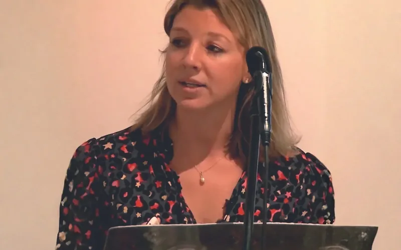 Bethan Davies speaking at a lectern